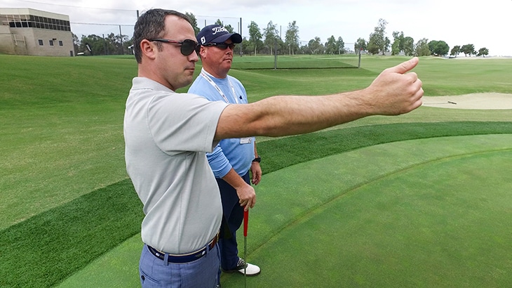 Chris helps Team Titleist member Kyle. 