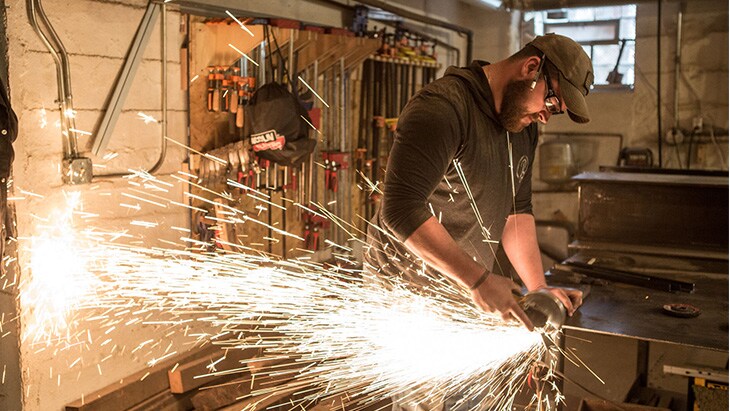 John is a custom furniture designer and...