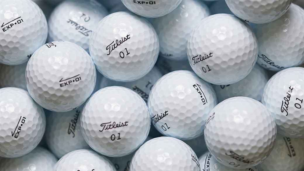 Photo of multiple EXP&bull;01 golf balls, ready for packaging.