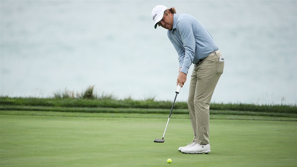 Zac Blair putting his Pro V1x yellow golf ball