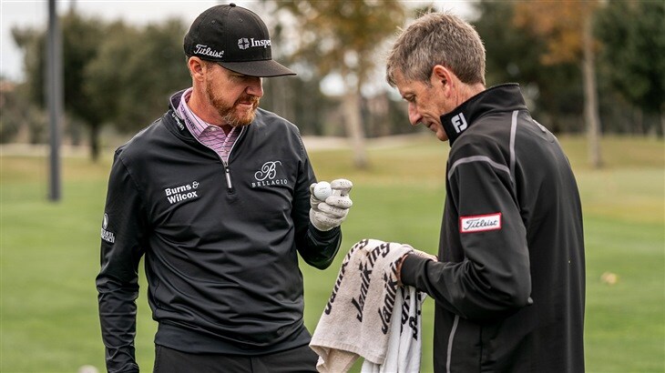 Jimmy Walker examines a new Pro V1x golf ball prototype during testing with Fordie Pitts, Titleist Tour Consultant for Golf Ball R&amp;D
